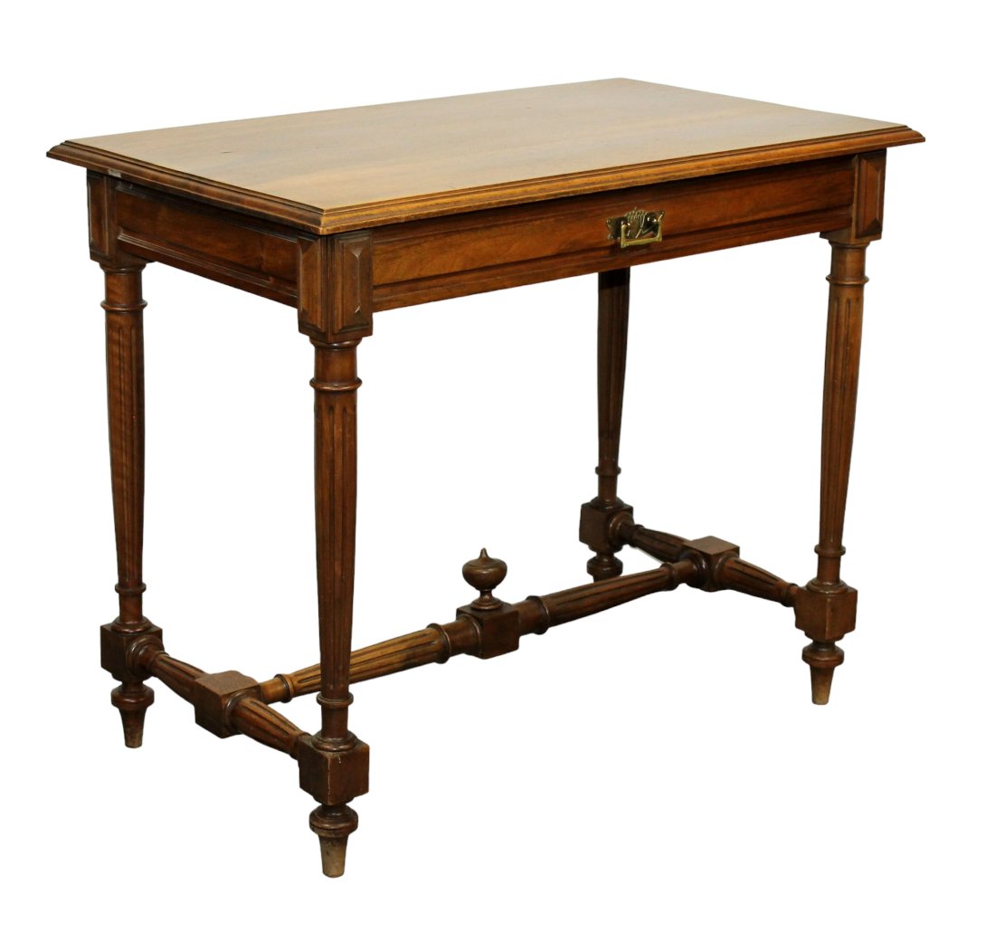 French bureau plat desk in walnut on fluted tapered legs: French bureau plat desk in walnut on fluted tapered legs. Early 20th century. 27 1/4"h x 37 3/4"w x 24 1/4"d