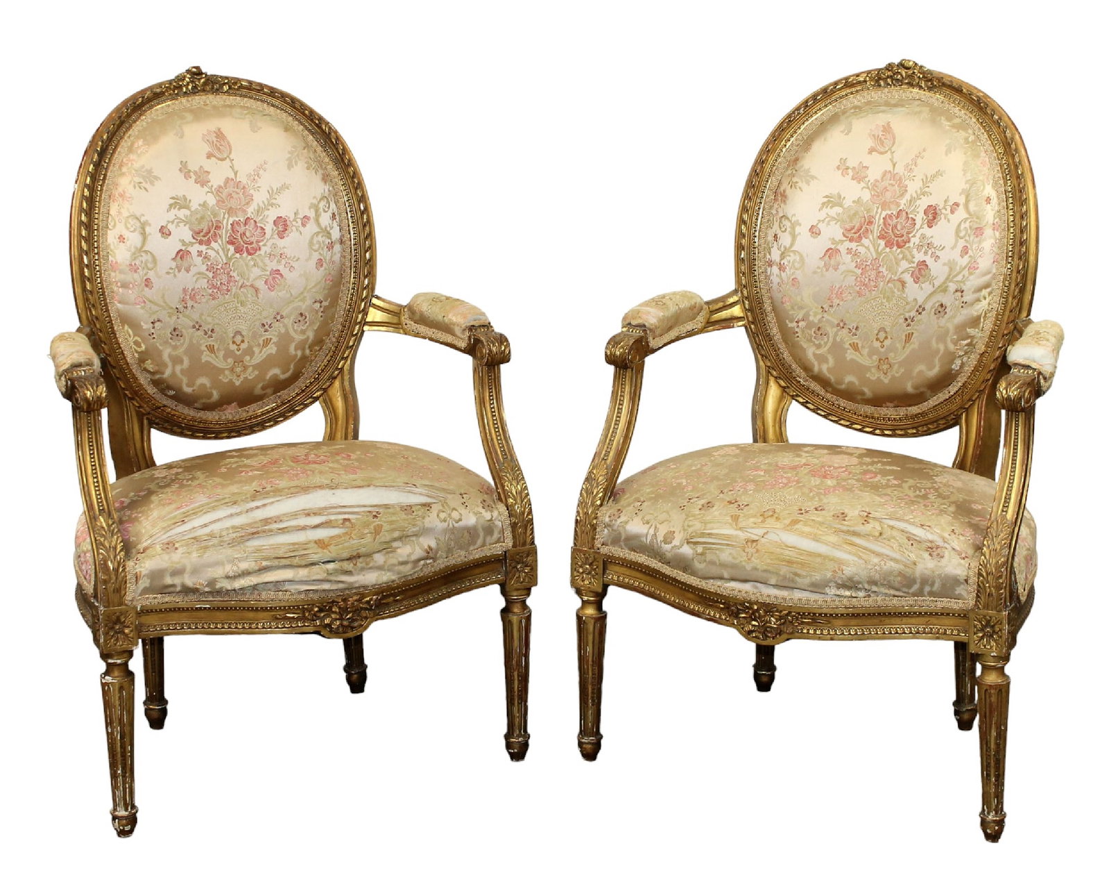 Pair of French Louis XVI style giltwood armchairs: Pair of French Louis XVI style gilt wood chairs. Early 20th century. 37 1/2"h x 23 5/8"w x 19"d, seat height 16 3/4"