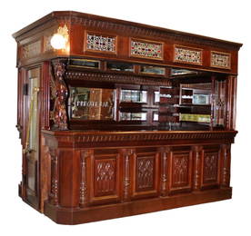 Canopy corner pub bar in carved mahogany with painted and stained glass ceiling