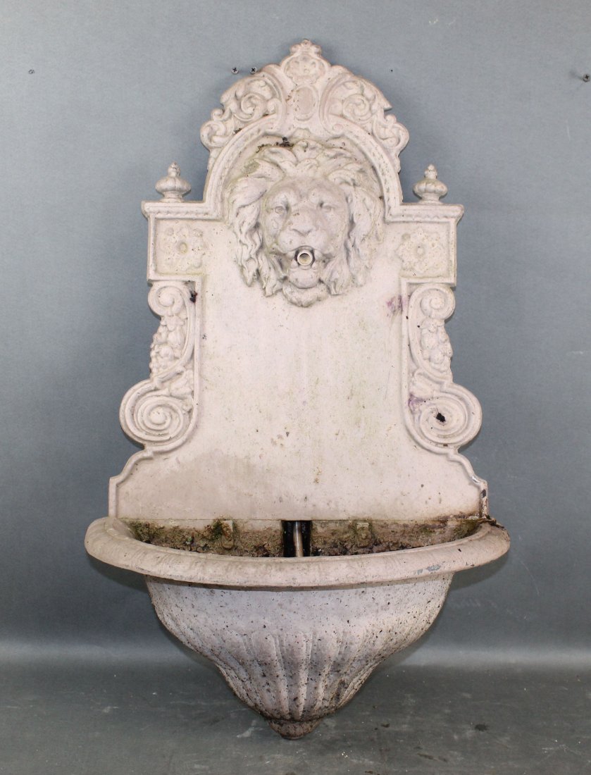 Cast iron wall fountain with lion mask: Cast iron wall fountain with lion mask. 30 7/8"h x 18 1/2"w x 11"d (approx). Weight: 30lbs