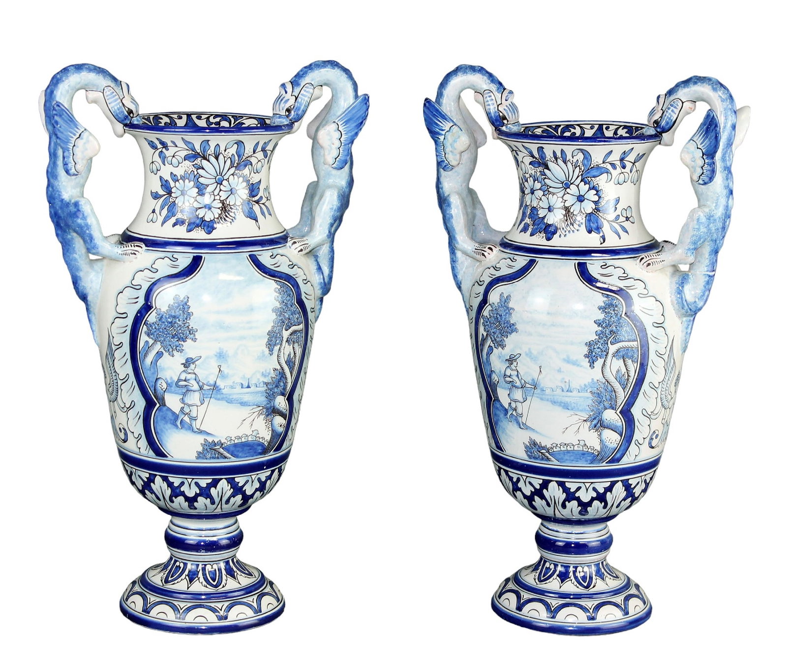 Pair French Gabriel Montagnon Nevers faience pedestal urns with dragon handles: Pair French Antoine 'Gabriel' Montagnon blue and white faience from Nevers pedestal urns with dragon handles. Signed A. Montagnon and 3 GM. 15 3/4"h x 9 1/4"w x 6 1/2"d. Total weight: 10 lbs (5 lbs ea