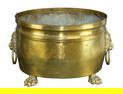 Oversize brass cache pot planter with lion heads on paw feet