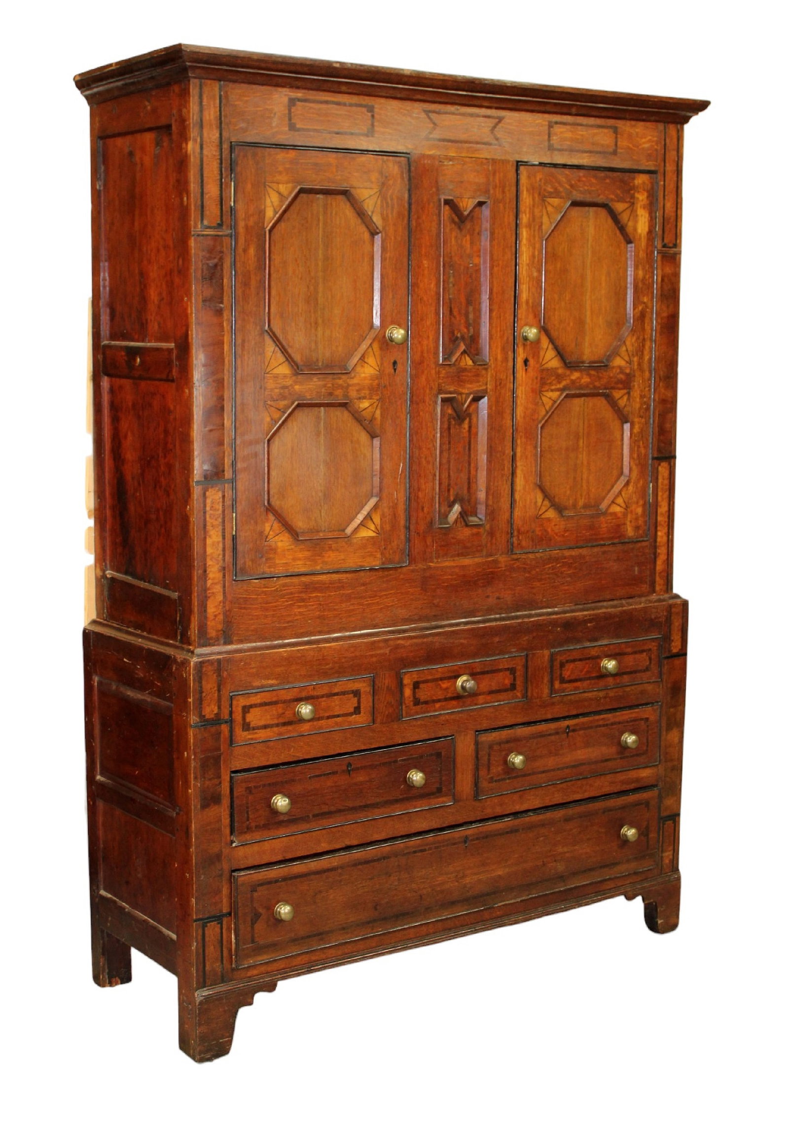 English tack cabinet in mixed woods with banded drawers: English tack cabinet in mixed woods with banded drawers. Early 19th century. 79 1/2"h x 54"w x 20"d