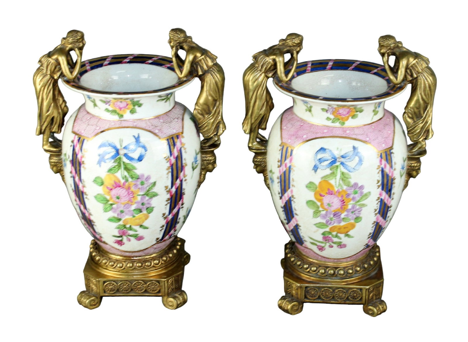 Pair of porcelain and bronze urns with female figural handles: Pair of porcelain and bronze urns with female figural handles. Late 20th century. 14"h x 9 1/4"w x 6 3/4"d. Weight: 21 lbs.