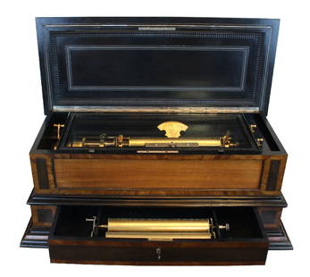 Swiss cylinder music box in inlaid mahogany case: 3-13 1/8"long cylinders. Circa 1905. 37 1/2"long x 14 1/2"h x 18"d