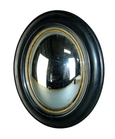 French Napoleon III oval butler's mirror in ebonized frame