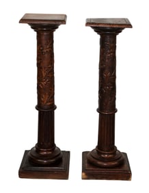 Pair of French pedestals in walnut with oak leaf and acorn carvings
