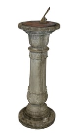 Copper sundial mounted on cast column form pedestal