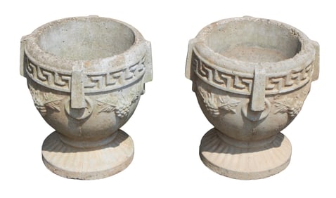 Pair of cast concrete garden urns with grapes