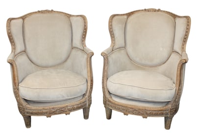 Pair of French Louis XV style carved walnut bergeres