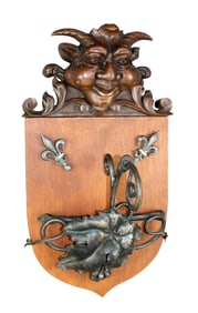 French wall sconce with carved satyr head