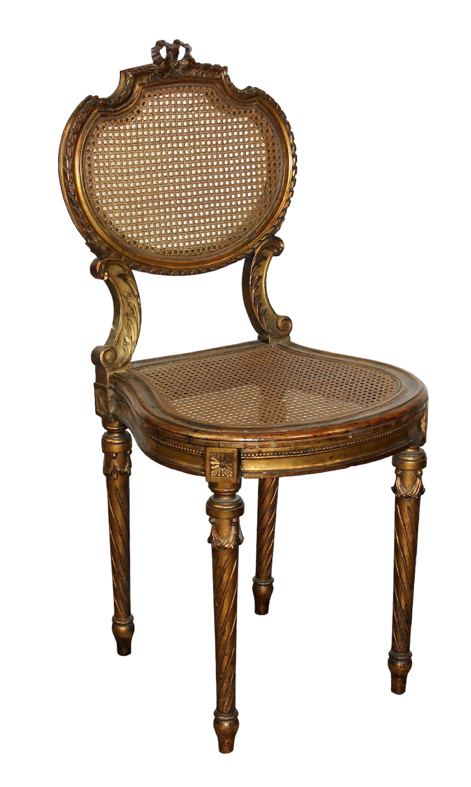 French Louis XVI style caned side chair in gilt finish: French Louis XVI style caned side chair in gilt finish. Early 20th century. 35"h x 16 1/4"w x 15 1/2"d, seat height 17 1/2"