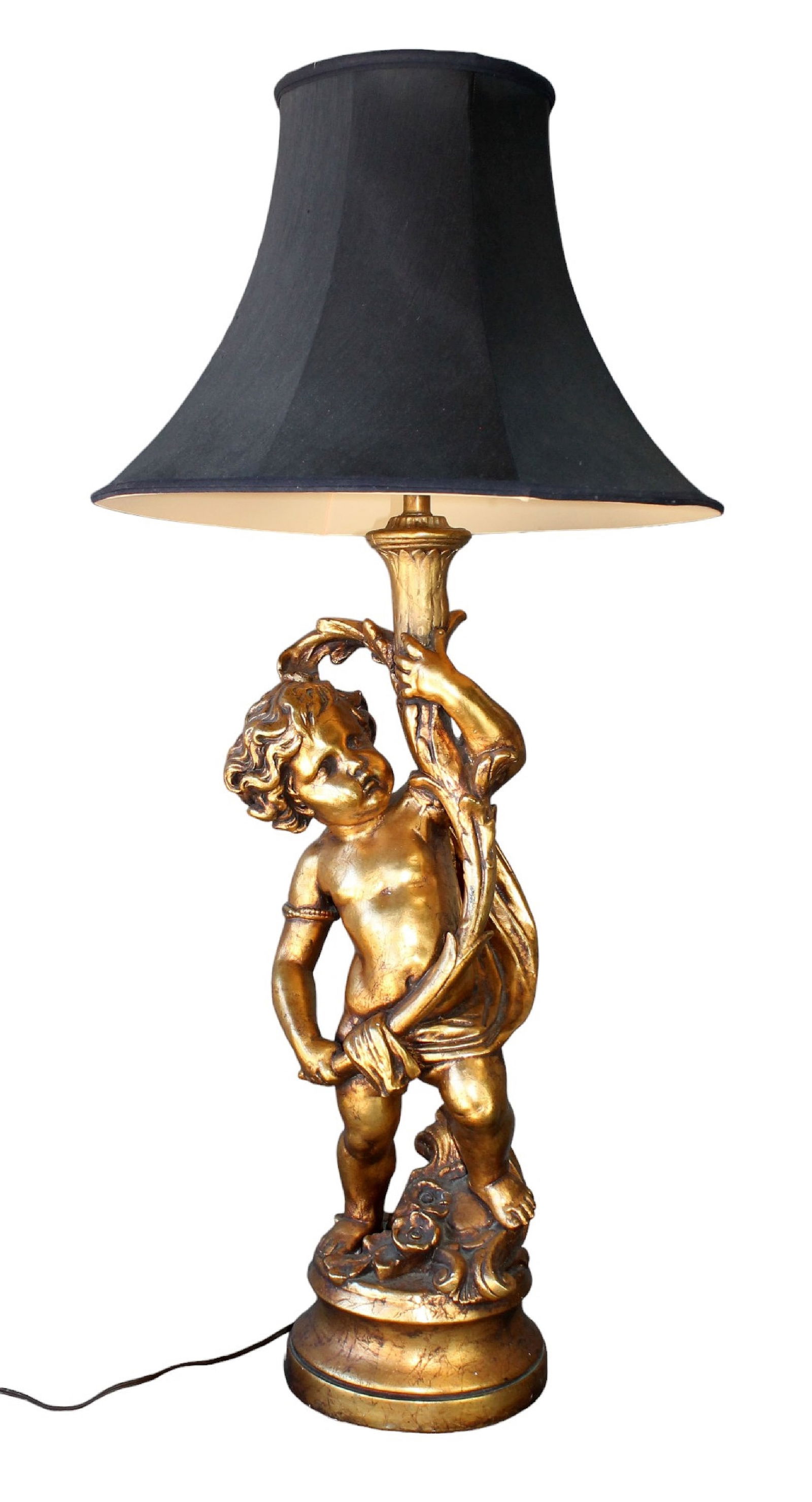 Cast and painted plaster cherub holding torch lamp: Cast and painted plaster cherub holding torch lamp. Late 20th century. Overall with shade 44"h 8 1/4"dia at base. Weight: 23lbs