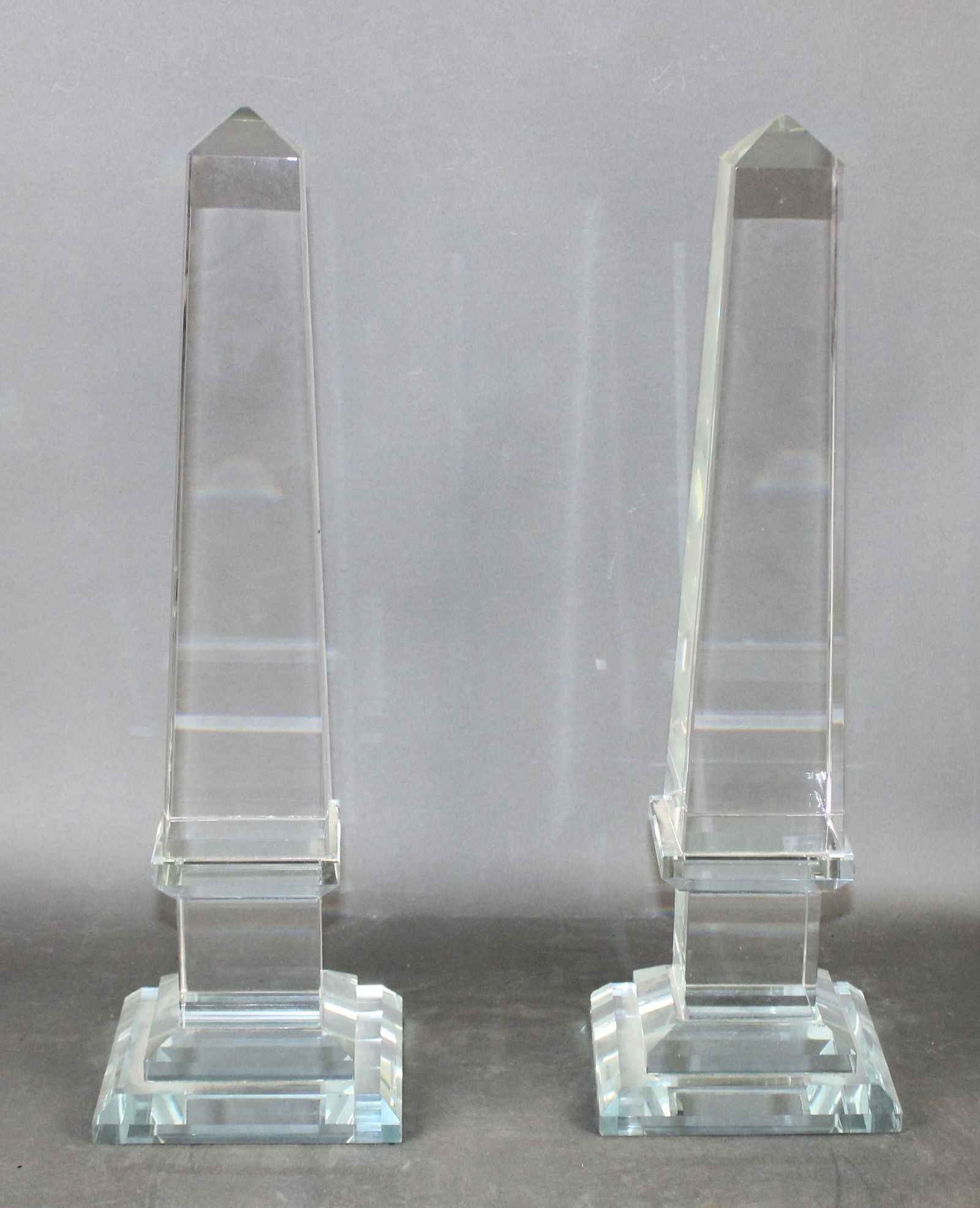 Pair of classical glass obelisks: Pair of classical glass obelisks. 16 1/2"h x 5"square at base Weight: 10lbs each