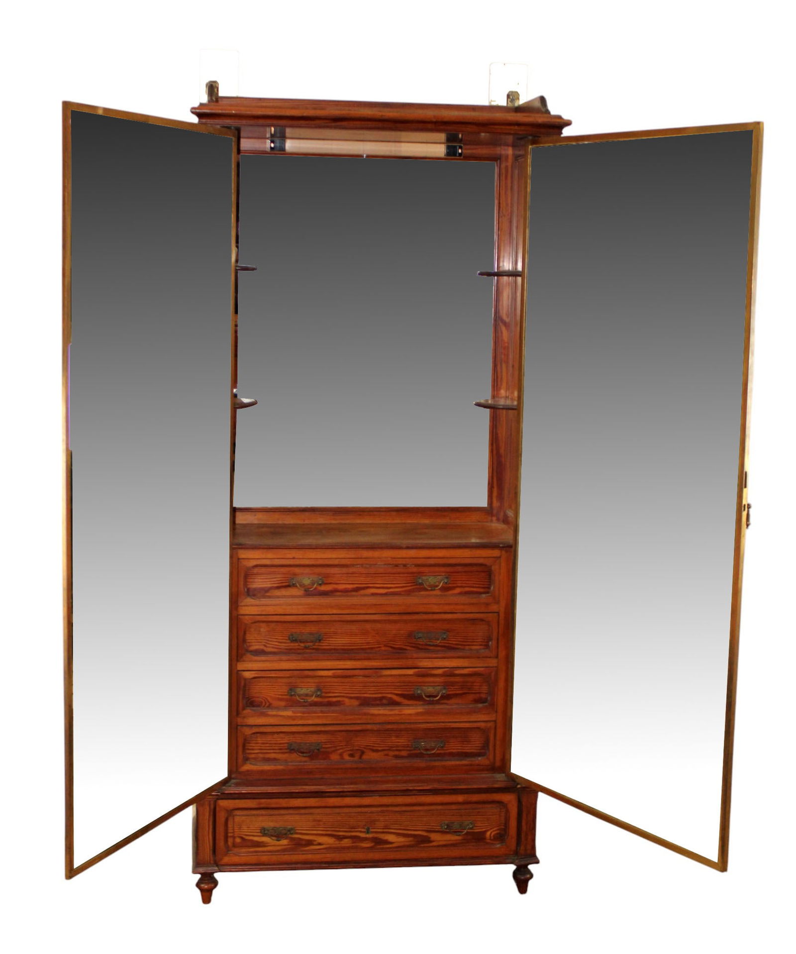 French Miroir Brot dressing cabinet in pine with triple mirror: French Miroir Brot dressing cabinet in pine with triple mirror. Beveled glass mirrored door opens to triple mirror on the inside and 4 drawers. Early 20th century. 75 1/8"h x 33 1/8"w x 14 5/8"d.