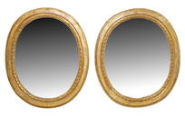 Pair of French 18th century oval gilt wood mirror frames with 19th century glass