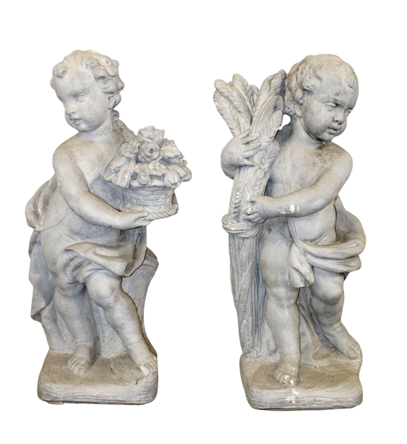 Pair of cast composition figural garden cherub statues (1 of 10)