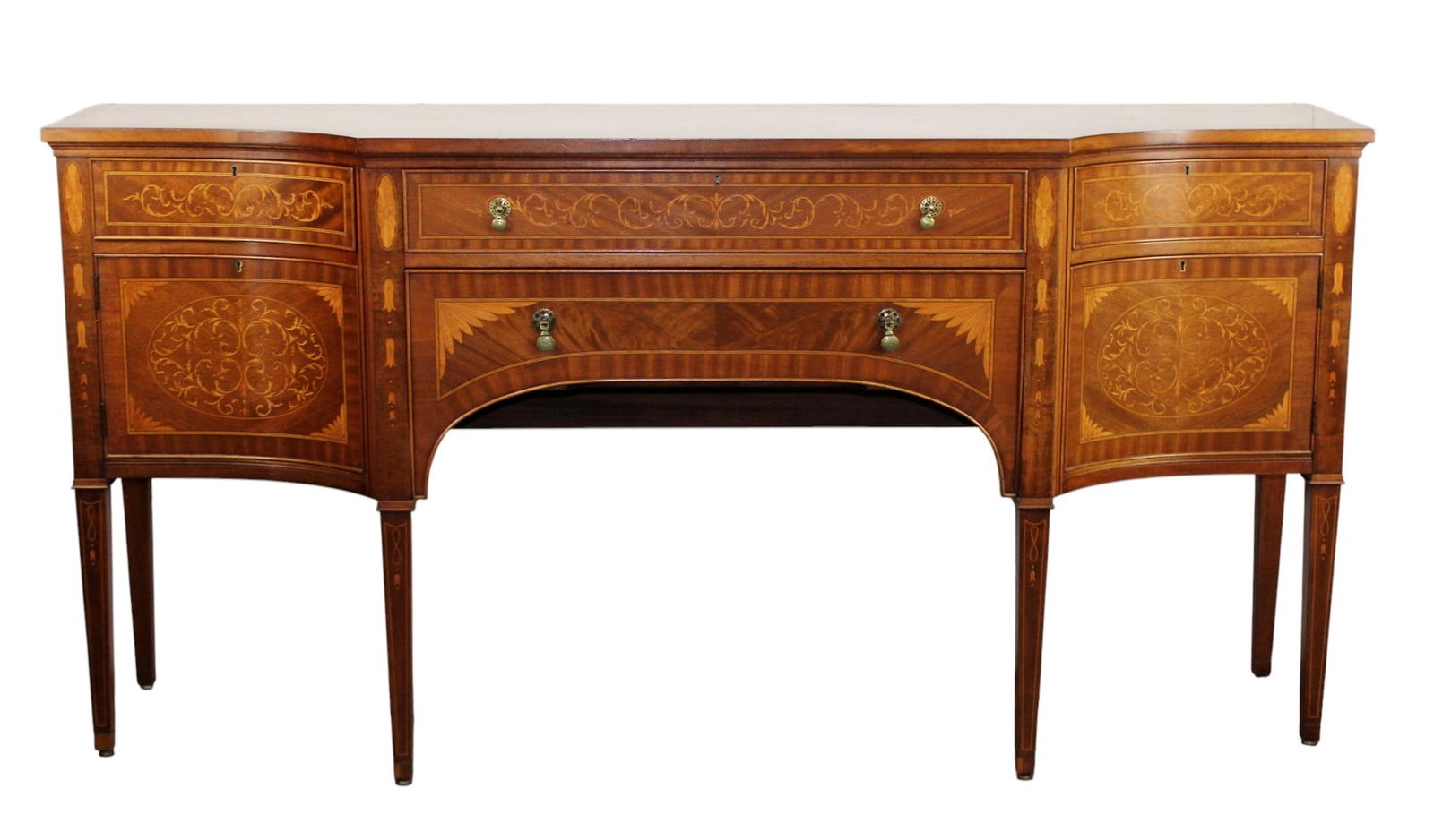 English inlaid sideboard in mahogany with pullout trivets: English inlaid sideboard in mahogany with pullout slides. Mid 20th century. 38 5/8"h x 77 5/8"w x 21 3/8"d.