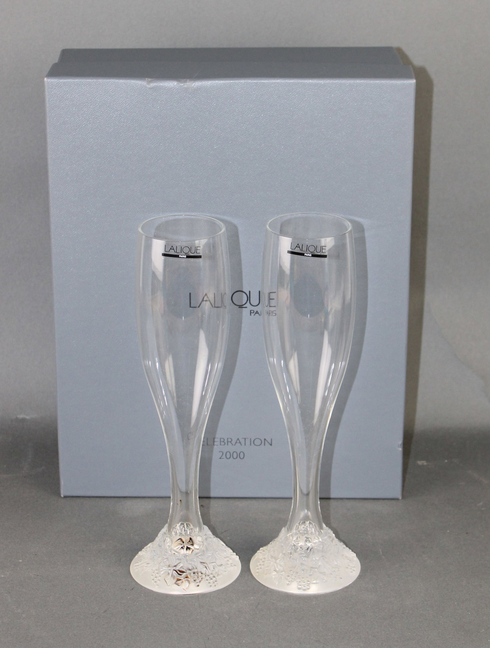 Lalique crystal celebration champagne flutes: Lalique crystal celebration 2000 champagne flutes. 9 1/2"h Weight: 4lbs