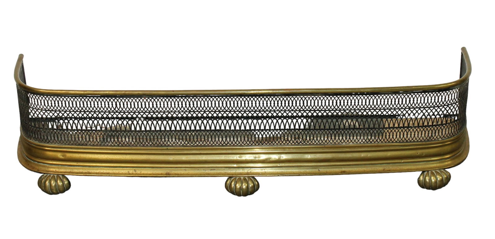 English brass & pierced steel curved fire fender on shell feet: English brass & pierced steel curved fire fender. Late 19th century. 10 1/4"h x 43 1/4"w x 10 1/8"d