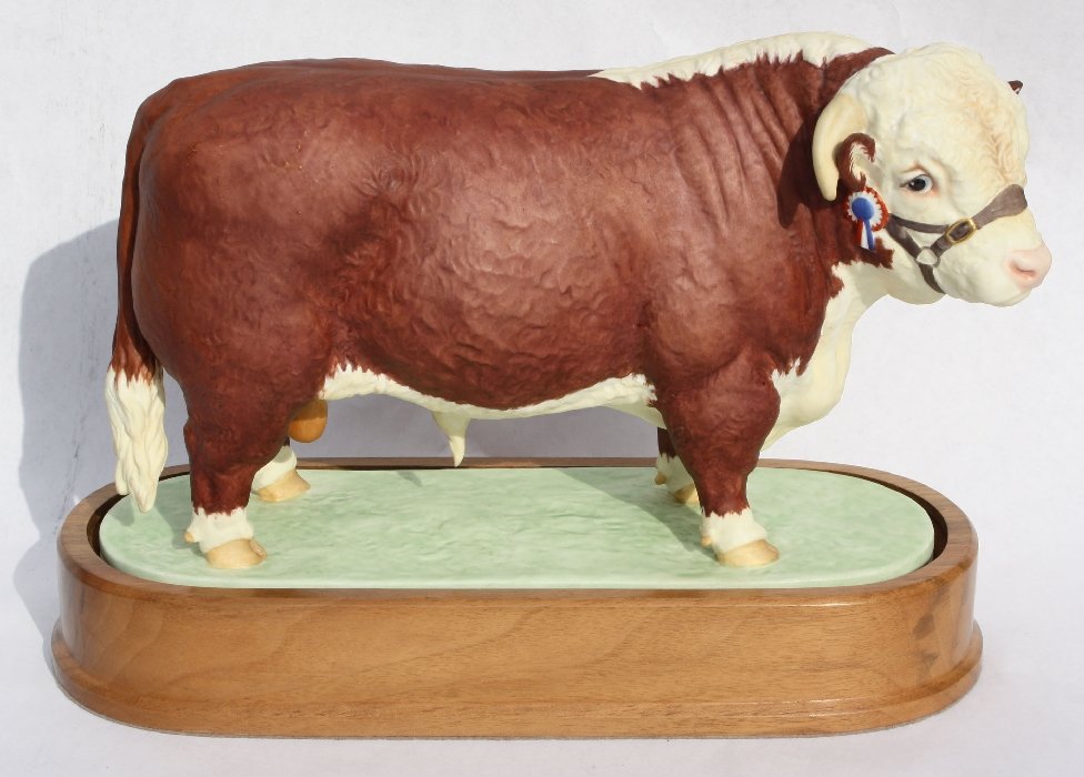 Royal Worcester limited edition - Hereford Bull,: 1959. English bone china figurine. On Wooden plinth. 8 1/4"h x 10 1/2"l