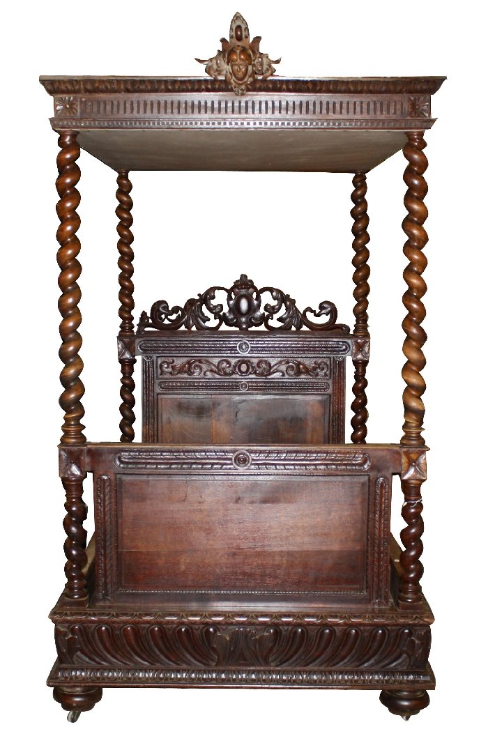French Louis XIII carved oak canopy bed with: cabochon crest and barley twist columns. 100 1/2"h x 80 1/2"l x 57 3/8"w