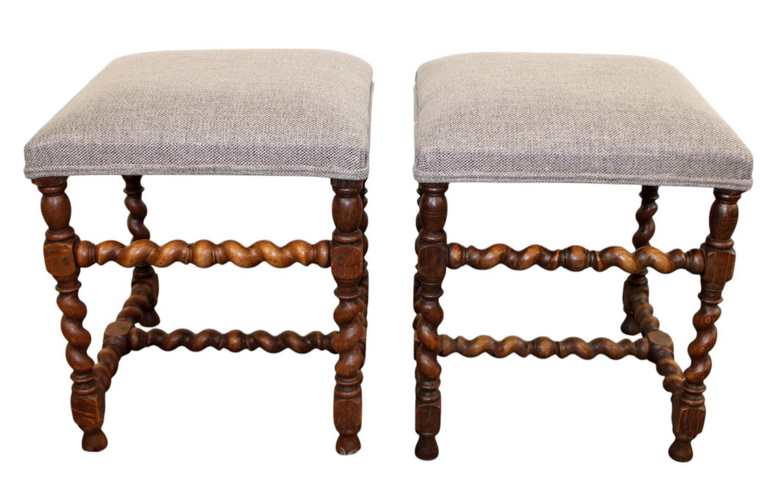 Pair of French barley twist walnut footstools: Pair of French barley twist walnut footstools. Early 20th century with new upholstery. 20"h x 17"w x 16 1/2"d