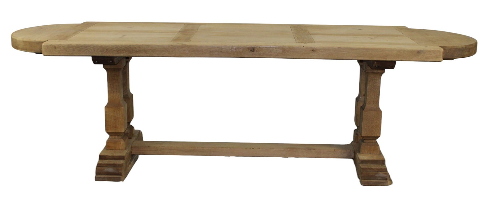 French curved end trestle table in natural oak: French curved end trestle table in natural oak with double column base. 30 1/2"h x 103 3/4"l x 35 1/2"d
