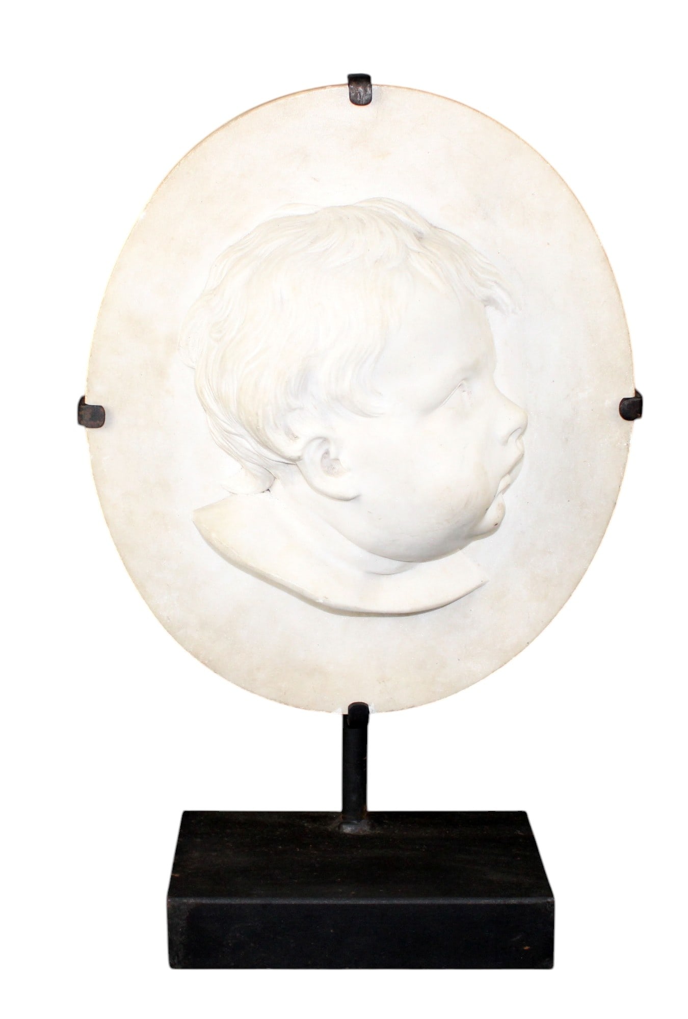 Relief marble portrait plaque of young boy. Mounted on iron stand: Relief marble portrait plaque of young boy. Mounted on iron stand. Overall 19 1/8"h x 12"w x 4 7/8"d Weight: 25lbs