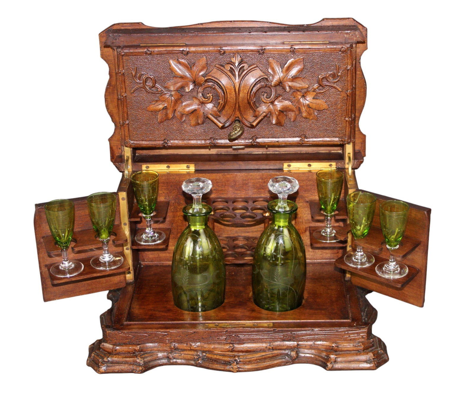 French carved oak tantalus and cigar box: French carved oak tantalus and cigar box with 2 decanters and 6 cordial glasses with etched glass. Early 20th century. Overall: 9 1/2'"h x 14"w x 8 3/4"d. Decanters: 7 3/4"h x 2 1/2"diam (each). Glass