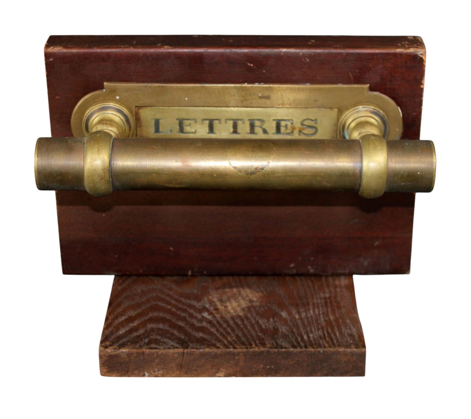 French brass door pull with letter slot: French brass door pull with letter slot. Mounted on display board. Early 20th century pull. Overall: 8 1/2"h x 11"w x 7 3/4"d. Door pull: 2 3/4"h x 10 5/8"w x 7 3/8"d. Overall weight: 6lbs.
