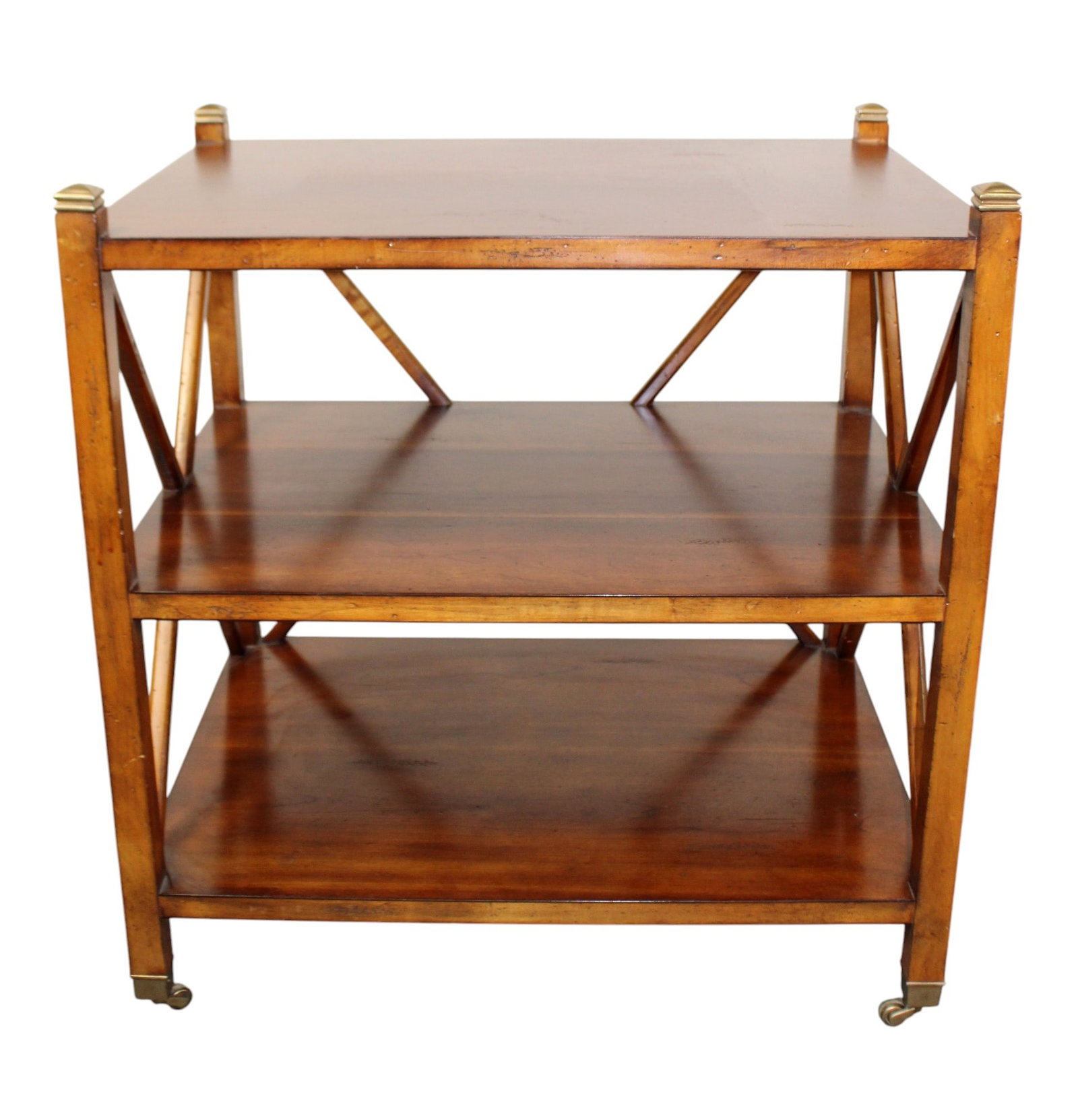 Sherrill mahogany tiered side table with crossed sides: Sherrill mahogany tiered side table with crossed sides. 21st century. 28 1/2"h x 27 1/4"w x 20 1/4"d