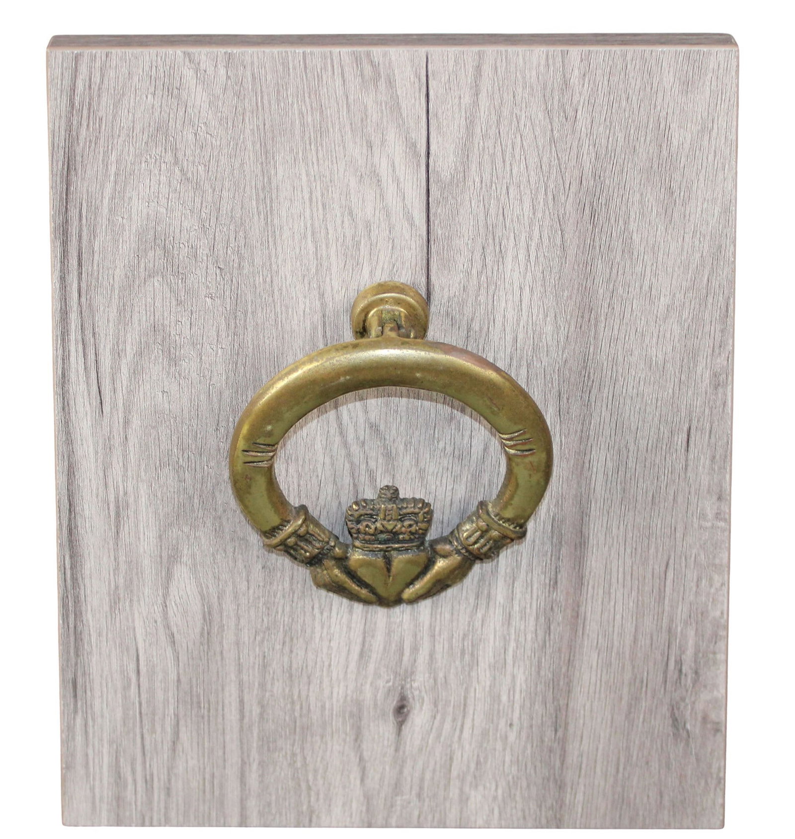 Irish Claddagh door knocker in bronze: Irish Claddagh door knocker in bronze mounted on board. Overall size (for shipping): 12"h x 9 1/4"w x 5"d. Total weight: 3lbs.