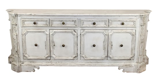 Italian 4 door credenza with canted sides, carved doors and a painted finish