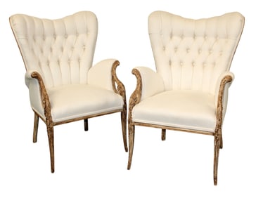 Pair of French carved and flared back armchairs with tufted backs