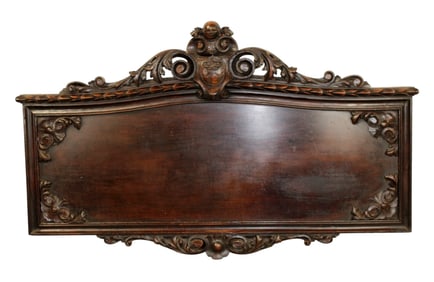 Italian carved walnut panel with cabochon crest