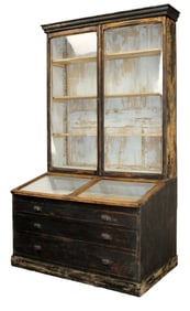 French shop vitrine with lift top glass display atop bank of drawers
