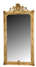 French grand scale gold leaf mirror with cherubs flanking cabochon chest with scallop shell