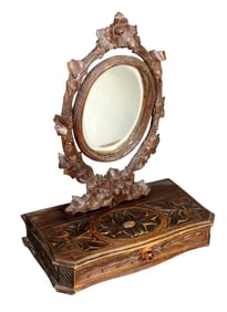 Black Forest carved vanity mirror on drawer