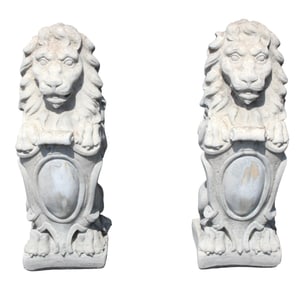 Pair of cast concrete garden seated lions with shields