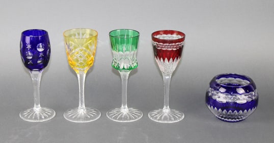 Faberge cut to clear crystal 4 stemmed cordial glasses and 1 votive holder
