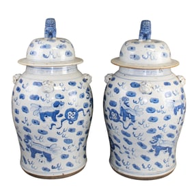 Pair Chinese blue & white porcelain ginger jars with foo dog finials