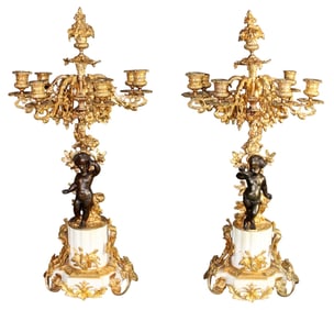 Pair of French gilt bronze candelabra with cherubs