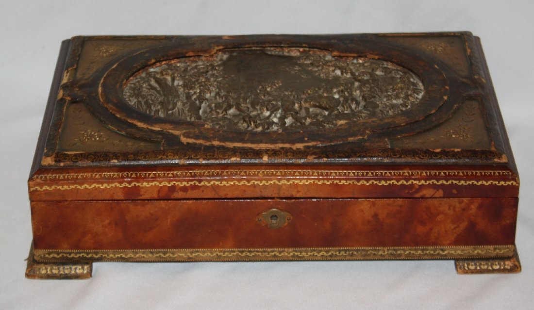 Tooled leather jewelry box with embossed brass: plaque with hunt scene. 14 3/8"l x 9 3/8"d x 3 3/4"h