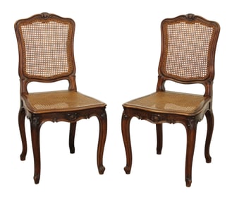 Pair of French Louis XV style carved walnut side chairs with cane seat and back