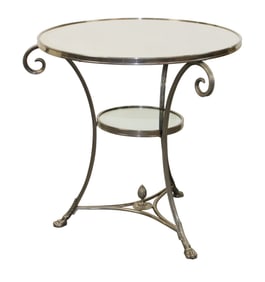 French Directoire style nickel over bronze gueridon table with mirror top on paw feet