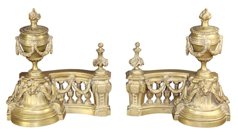 Pair of bronze chenets with lion masks and swagged urns with Greek Key design