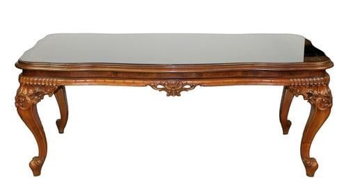 Italian dining table in carved walnut with black glass top