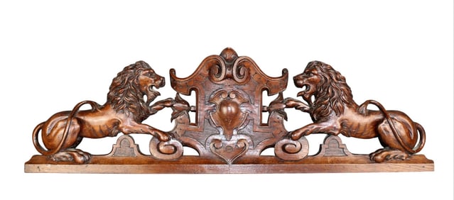French relief carved oak crest with lions flanking cabochon crest
