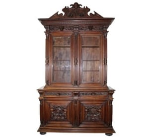 Grand scale French Renaissance bookcase in walnut with carved crest